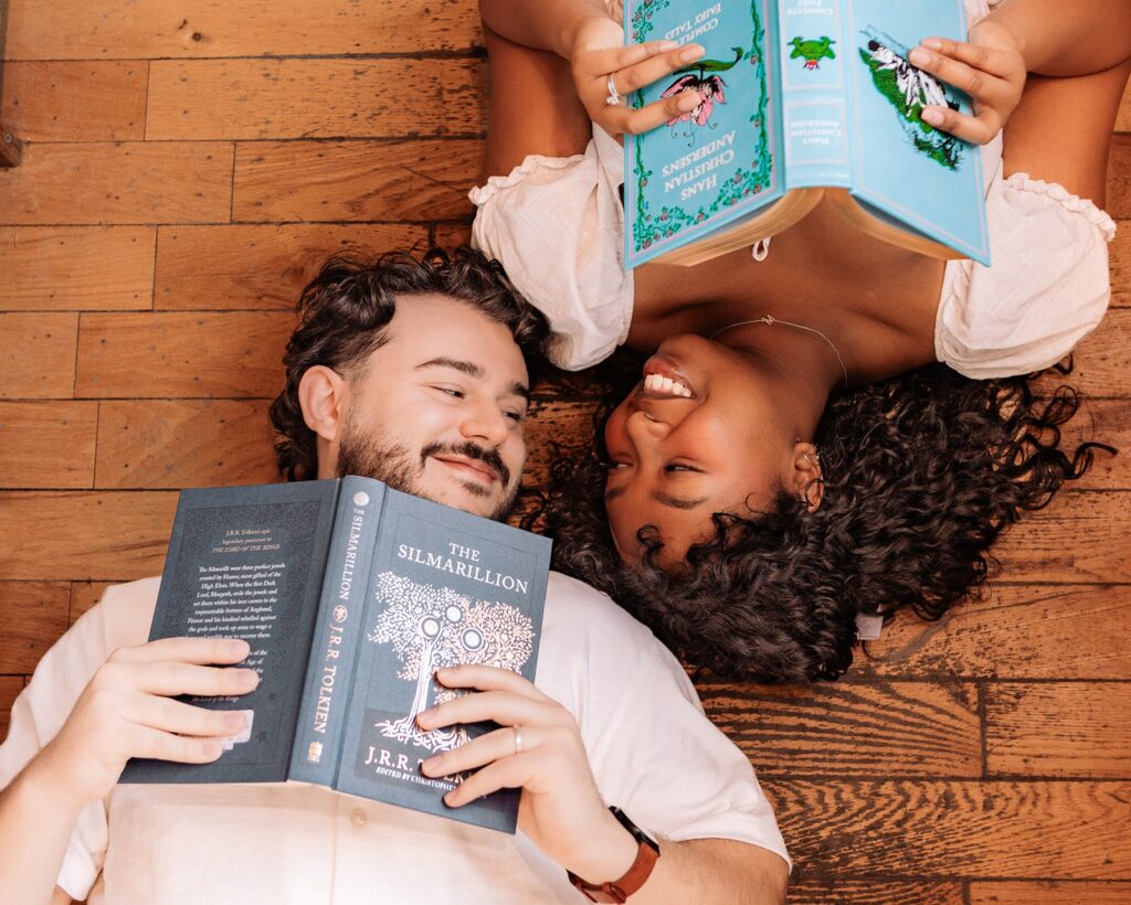 Couple looking at each other during a break from reading their books