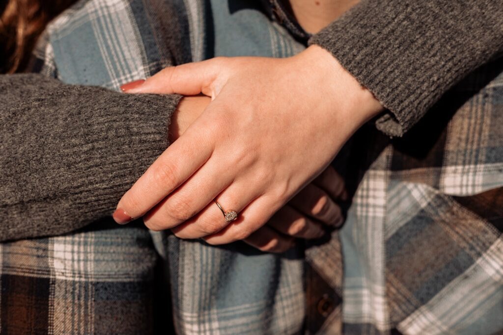 Close up shot of an engagement ring on brides hand