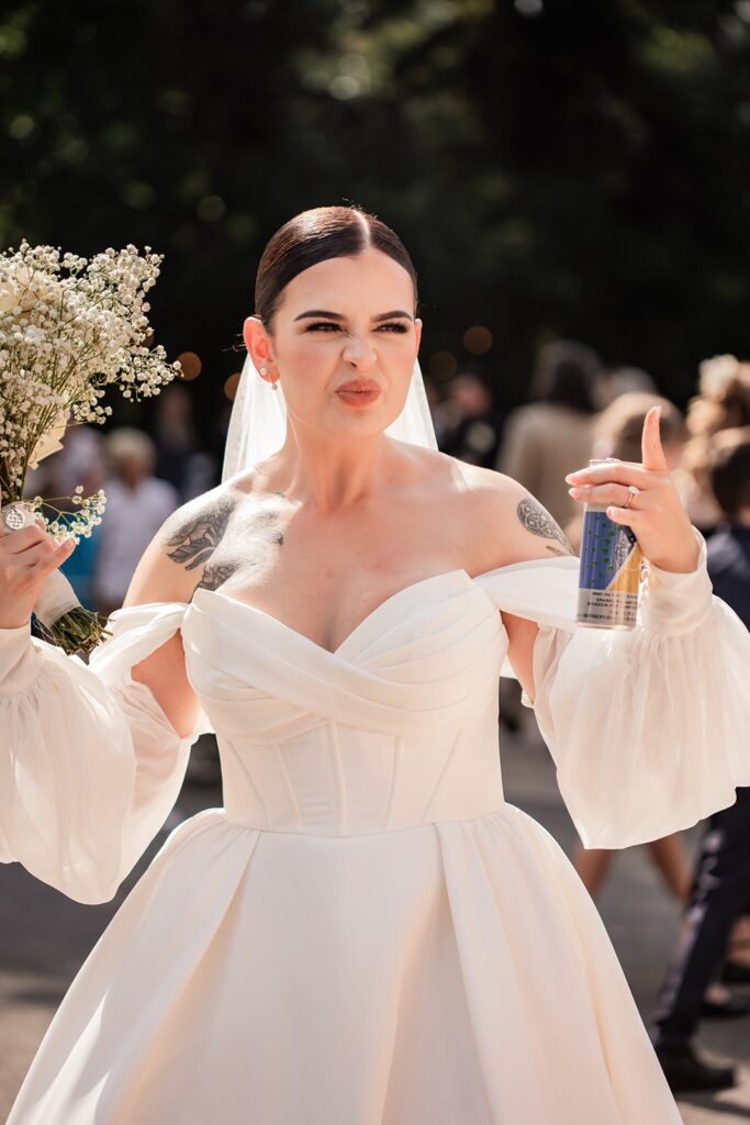 Bride enjoying a drink after her wedding ceremony
