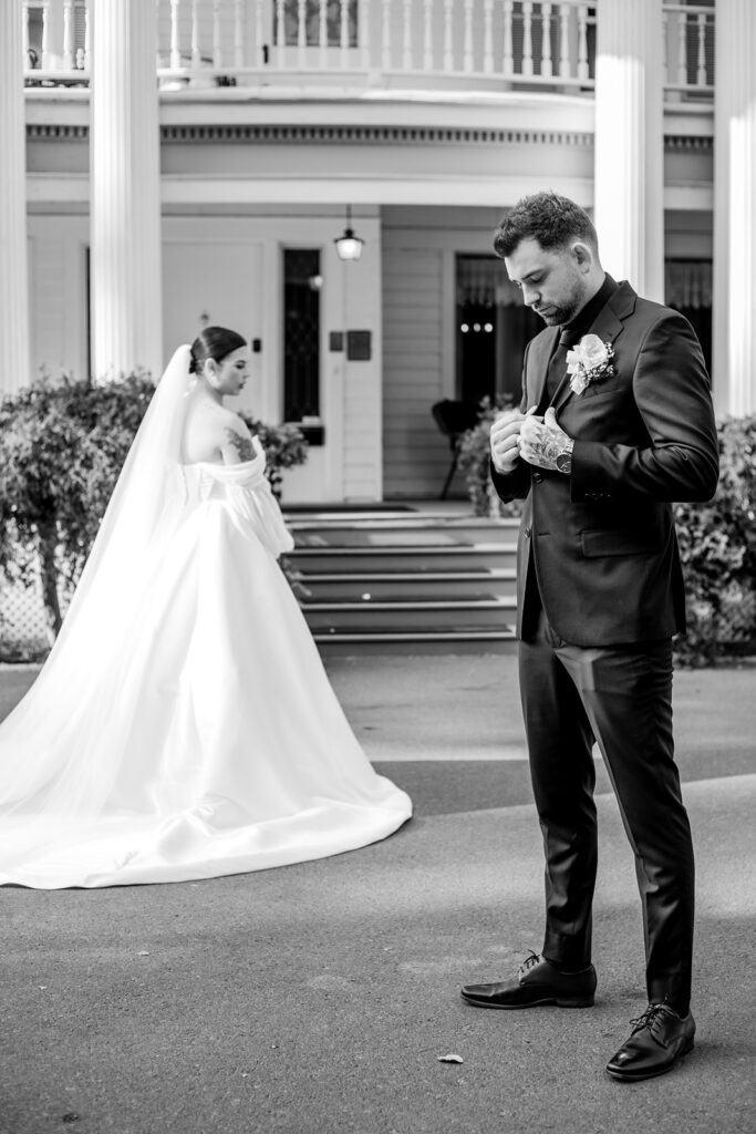 Bride and groom posing in front of the Norland Historic Estate