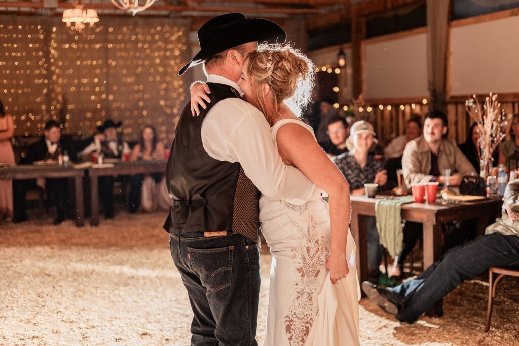 Bride and groom hugging after their first dance