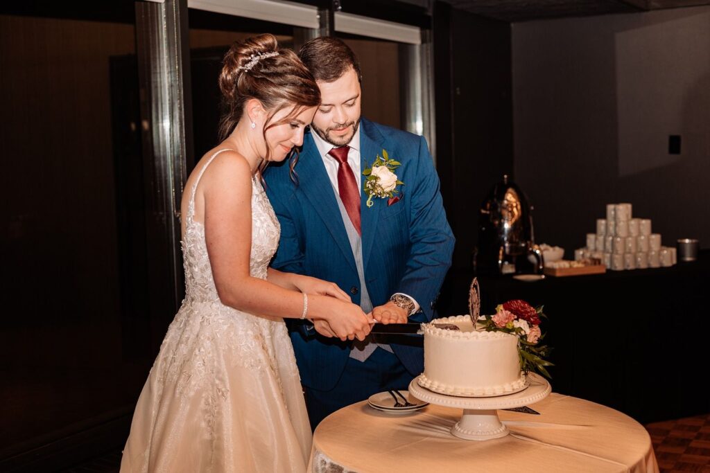 Bride and groom cut their wedding cake