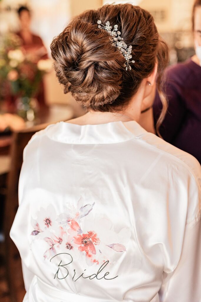 Bride in a bridal gown with her wedding hair done