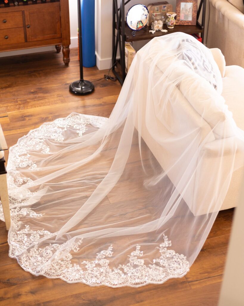 Brides veil laid out in the living room