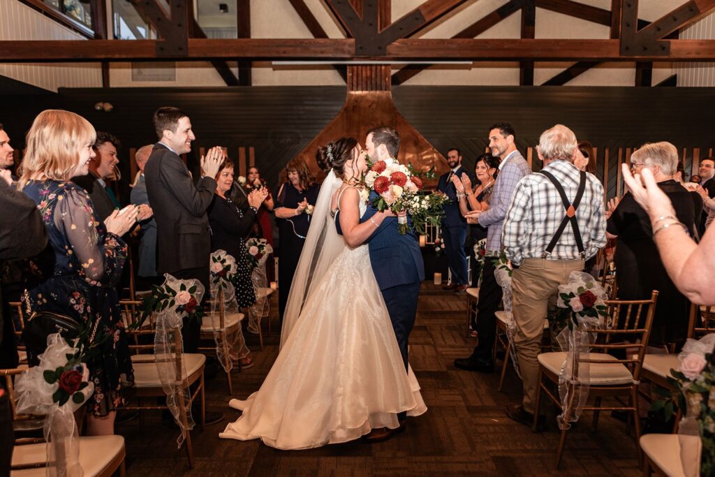 Bride and groom kiss in the Valleyview Terrace room