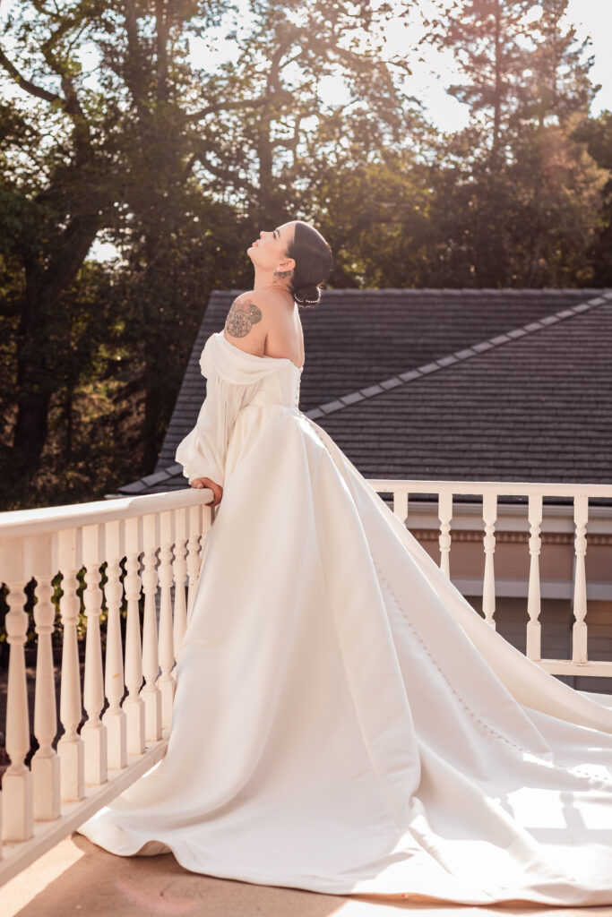 Bride soaking in the sun on the balcony of the Norland Historic Estate