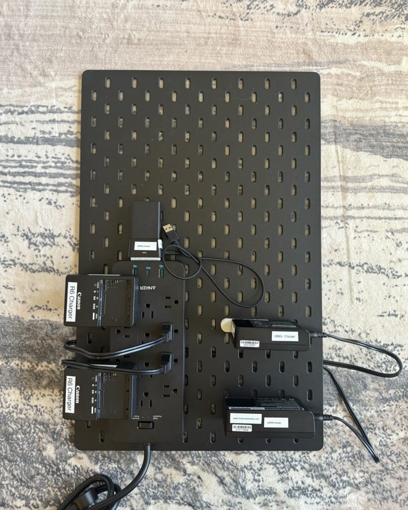 Camera charging station gear all attached with command strips