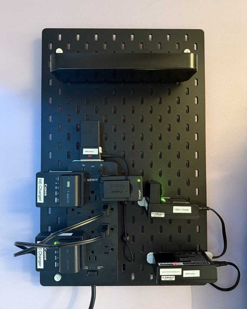 Completed DIY Camera Charging Station installed on the wall and plugged in