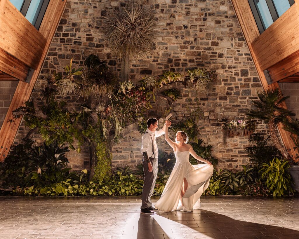 Wedding couple dancing in the conservatory 