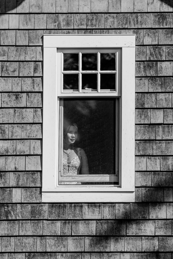 A shot of the bride watching guests arrive 